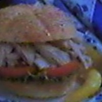 Shredded Chicken On a Sesame Roll with Lettuce & Tomatoes Shredded Chicken On a Sesame Roll with Lettuce & Tomatoes
